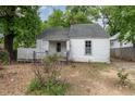 Quaint one-story house with a lattice-enclosed porch and compact yard at 511 E Maynard Ave, Durham, NC 27704