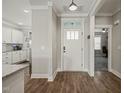 Bright foyer with wood floors, white trim, and easy access to kitchen and office at 60 Heart Pine Dr, Wendell, NC 27591
