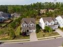 An aerial view of a lovely neighborhood with a well-kept lawn and a two-car garage at 638 Boulder Point Dr, Chapel Hill, NC 27516