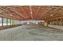 Spacious indoor riding arena, showcasing a well-lit and well-maintained equestrian facility at 754 Epps Clark Rd, Siler City, NC 27344