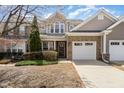 Charming brick and vinyl two-story home with well-maintained landscaping and attached two-car garage at 9207 Wooden Rd, Raleigh, NC 27617