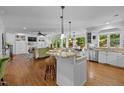 Open-concept kitchen featuring a center island with granite countertops and stainless steel appliances at 106 Birkhaven Dr, Cary, NC 27518