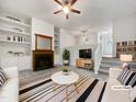 Inviting living room with a fireplace, built-in shelves, and a stylish striped rug at 122 Mallard Ct, Chapel Hill, NC 27517