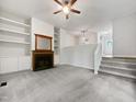 Bright living room featuring a fireplace, built-in shelving, and neutral decor at 122 Mallard Ct, Chapel Hill, NC 27517