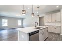 Kitchen and living area with stainless steel appliances, granite countertops and light, neutral paint at 1234 Pioneer Lot 3 Dr, Sanford, NC 27330