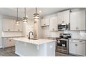 Kitchen with white cabinets, granite counters, stainless appliances, and central island with pendant lighting at 1234 Pioneer Lot 3 Dr, Sanford, NC 27330