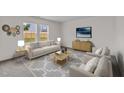 Bright living room with neutral paint, stylish furniture, and large windows for natural light at 141 Gladstone Loop, Clayton, NC 27520