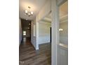 Spacious foyer featuring hardwood floors, modern lighting, and elegant trim work throughout at 244 Kipling Crk Dr, Fuquay Varina, NC 27526