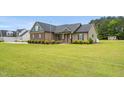 Well-maintained home featuring a spacious yard and traditional design at 3345 Little Creek Church Rd, Clayton, NC 27520