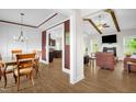 Open floor plan with hardwood floors seamlessly connects living and dining spaces at 3345 Little Creek Church Rd, Clayton, NC 27520