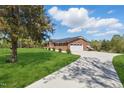 Beautiful brick home features a two-car garage and long driveway at 3540 Sellars Rd, Mebane, NC 27302