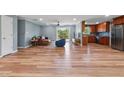 Spacious living room featuring wood floors, modern lighting, and open layout at 3540 Sellars Rd, Mebane, NC 27302
