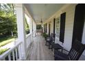 Inviting front porch with rocking chairs and ample space for relaxation, perfect for enjoying quiet mornings at 423 Oakland Dr, Raleigh, NC 27609