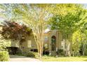 Traditional home with lush landscaping, mature trees, and a welcoming front facade at 5129 Bartons Enclave Ln, Raleigh, NC 27613