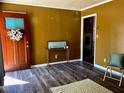 Inviting entryway with wood flooring and a decorative wreath on the front door at 543 Stockyard Rd, Staley, NC 27355