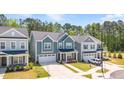 Attractive two-story home with an attached two-car garage, nestled in a neatly landscaped neighborhood at 608 Cormiche Ln, Wake Forest, NC 27587