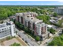 Attractive aerial view of the brick apartment building offering tree-lined street views and visible rooftop features at 618 N Boylan Ave # 400, Raleigh, NC 27603