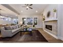 Spacious living room featuring hardwood floors, neutral tones, a fireplace, and large windows for natural light at Tbd Hudson Hills Rd, Pittsboro, NC 27312
