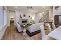 Bright living room with hardwood floors, fireplace, and comfortable seating, open to kitchen and dining area at Tbd Hudson Hills Rd, Pittsboro, NC 27312