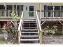 Inviting front entrance with charming flower beds leading up to the covered porch and front door at 1176 Stoney Mountain Rd, Rougemont, NC 27572
