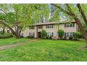 Attractive townhouse with a neat lawn, mature trees, and pleasant surroundings at 1217 Manassas Ct # H, Raleigh, NC 27615