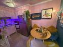 Fun kitchen featuring colorful artwork, stainless steel appliances, and a quirky aesthetic at 124 Fidelity St # Apt 27, Carrboro, NC 27510