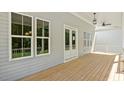 Expansive back porch with a ceiling fan, ideal for outdoor entertaining at 1733 Birdhaven Ln # 2217, Wendell, NC 27591
