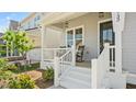 Inviting front porch with rocking chairs, perfect for relaxing outdoors at 1733 Birdhaven Ln # 2217, Wendell, NC 27591