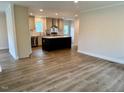 Open concept kitchen with an island and modern stainless steel appliances at 209 King St, Oxford, NC 27565