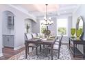 Elegant dining room featuring coffered ceilings, stylish furniture, and natural light from the windows at 3017 Dog Rose Dr # 169, Durham, NC 27703