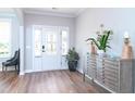 Welcoming foyer with wood floors, and an ornate cabinet, creating a warm and inviting entrance at 3017 Dog Rose Dr # 169, Durham, NC 27703