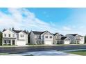 New construction homes line the street, showcasing modern design and inviting curb appeal under a clear blue sky at 4017 Shadbush St, Raleigh, NC 27616