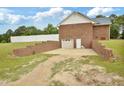Backyard with a two-car garage, storage space, and well-kept lawn at 6042 Elliott Bridge Rd, Linden, NC 28356