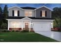 Charming new construction home featuring a two-car garage and professionally landscaped yard at 659 White Birch Ln, Angier, NC 27501