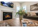 Cozy living room with a fireplace, mantel, and decor at 681 Beacon Hill Rd # 38, Lillington, NC 27546