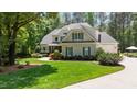 Attractive home exterior with a lush lawn and well-maintained landscaping at 7400 Portpatrick Ct, Wake Forest, NC 27587
