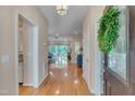 Welcoming foyer with hardwood floors leading to spacious living area and a view of the backyard at 7705 Astoria Pl, Raleigh, NC 27612