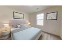 Bright bedroom features a queen bed, neutral walls, carpeted floors, and a window with lots of natural light at 914 Bombardier Aly, Spring Hope, NC 27882