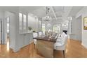 Elegant dining room featuring stylish decor, chandelier lighting, and hardwood flooring at 10410 Rosegate Ct # 307, Raleigh, NC 27617