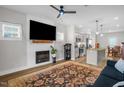 Inviting living room with fireplace and views into open kitchen at 109 E Fayetteville St, Micro, NC 27555
