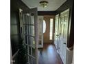 Inviting entryway with hardwood floors, decorative doors, and a view of the front door at 1102 Parkwood Dr, Siler City, NC 27344