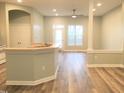 Open living area with abundant natural light and access to the kitchen at 113 Conner Dr # 203, Chapel Hill, NC 27514