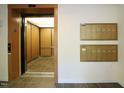 Lobby with an elevator and wall-mounted mailboxes at 113 Conner Dr # 203, Chapel Hill, NC 27514