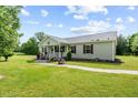 Well maintained single-story home on a grassy lot with a covered porch at 1510 Asbury Church Rd, Sanford, NC 27330