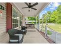 Inviting front porch featuring seating, a porch swing, and ample space at 1510 Asbury Church Rd, Sanford, NC 27330