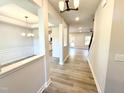 Inviting foyer with wood-look floors, neutral paint, and open sightlines to dining and living areas at 1667 Pecan Drive # 25, Nashville, NC 27856