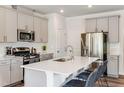 Contemporary kitchen with a large island, stainless steel appliances, and ample cabinet space for storage at 244 Paramount Dr # 24, Smithfield, NC 27577