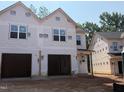 New construction home featuring a two-car garage and classic architectural details; ready to be customized to your taste at 33 Calluna Dr, Clayton, NC 27520