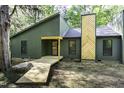 Modern home with a wooden walkway to the front door, showcasing unique architectural design at 434 Robin Rd, Chapel Hill, NC 27516