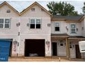 New construction townhome exterior with a garage and covered entrance, ready to be customized at 45 Calluna Dr, Clayton, NC 27520